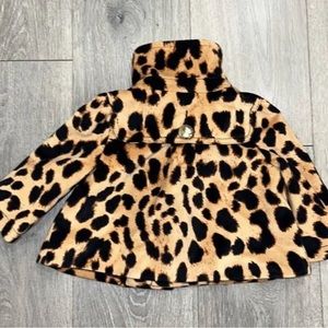 Baby gap faux fur coat. Bougie and cool. Add ears and black pants for a costume